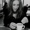 Jules enjoying a warm coffee on a rainy day