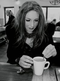 Jules enjoying a warm coffee on a rainy day