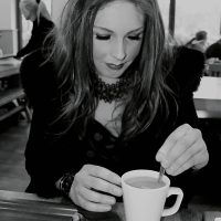 Jules enjoying a warm coffee on a rainy day