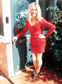 Crystal in a short red cocktail Dress - Translife Dressing Service September 2026. Crystal Jones - Translife Dressing Service Model